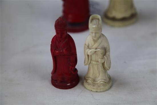 A 19th century Macau carved and stained ivory chess set, king 4.75in.